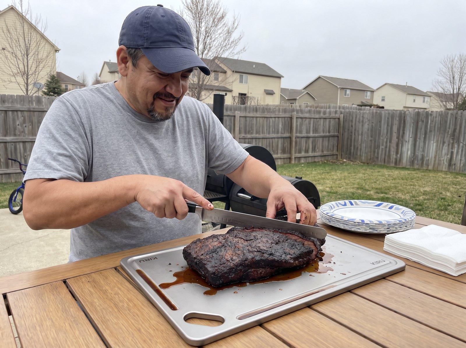 Mike slicing a smoked brisket on the Kiru titanium board
